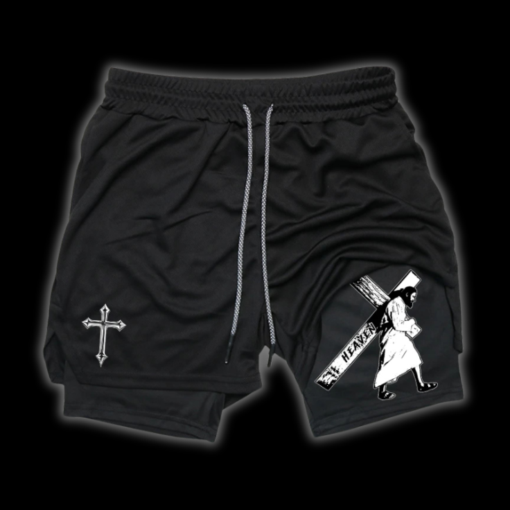 Close up front view of LuxCrux Jesus Shorts, Black/Black variant on a black background